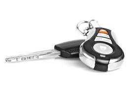 white background and a single key and remove door unlock fob on a ring